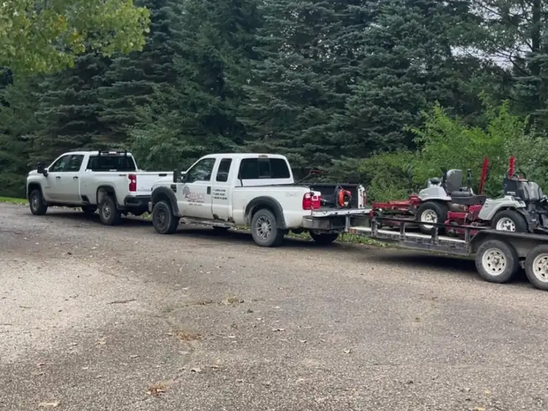 Landscaping trucks and equipment ready for service