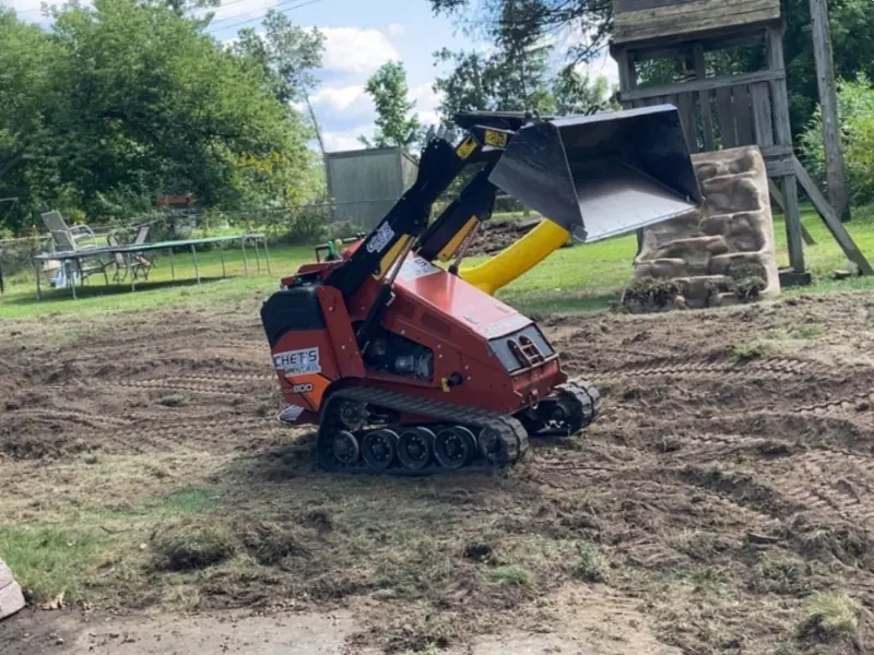 Yard grading work with a mini skid steer